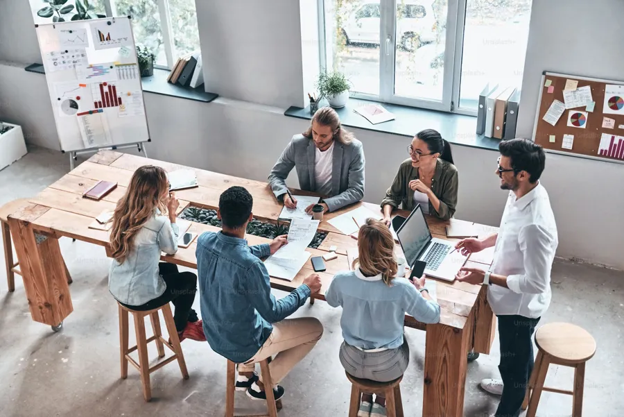 Team members working together around a table